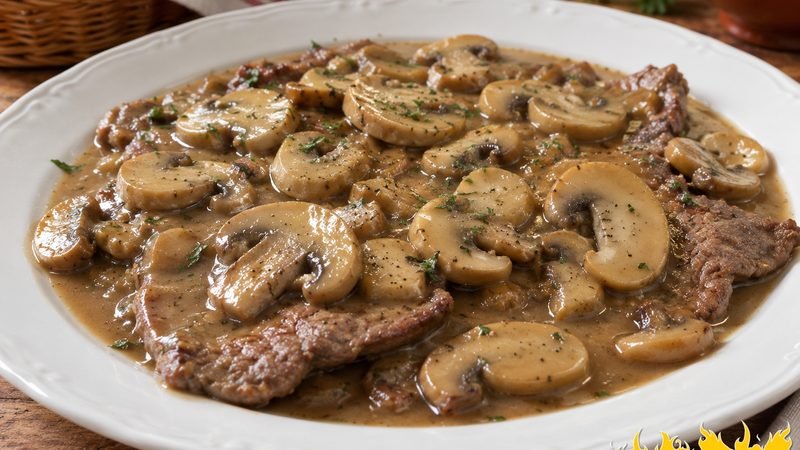 Bifes de vitela com molho de cogumelos